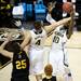 Michigan junior Tim Hardaway Jr. and freshman Mitch McGary reach for a rebound in the game against South Dakota State on Thursday, March 21. Daniel Brenner I AnnArbor.com
